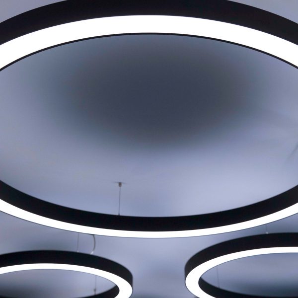 White, circular lighting on the ceiling of ICG's office in central London